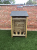 Small featheredge log store with felt roof and shelf