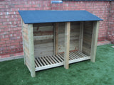 Large featheredge log store with felt roof