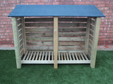 Large slatted log store with felt roof