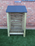 Small slatted log store with felt roof