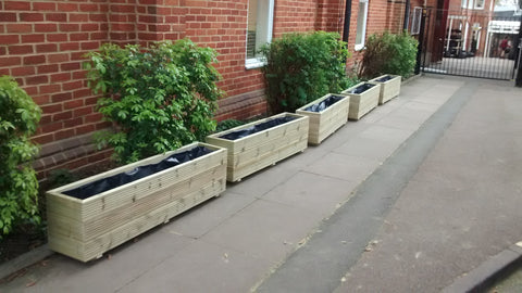 3 rows of decking trough planters