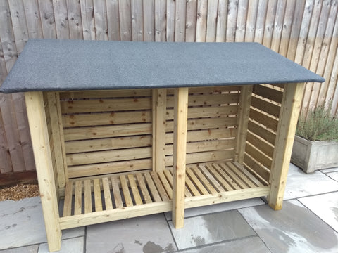 Large slatted log store with felt roof